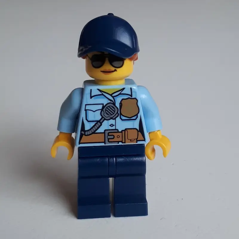Policewoman Sam Solo, Bright Light Blue Shirt with Radio and Badge, Dark Blue Legs, Dark Blue Cap with Hair, Sunglasses